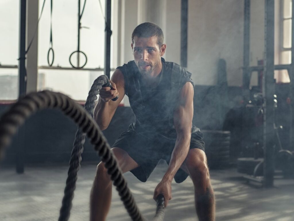 a man using heavy ropes