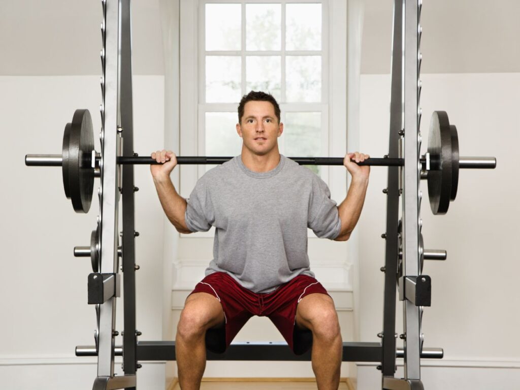 man lifting weights